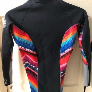 Rip Curl wet suit Top with 1/4 zip. Never worn.